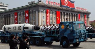 North Korea displays apparently new missiles as U.S. carrier group approaches