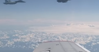 Russian Su-27 warns off NATO F-16 trying to approach defense minister’s plane over Baltic (VIDEO)