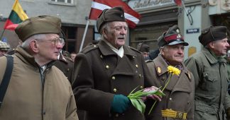 Latvia’s Waffen-SS veterans march alongside far-right lawmakers (VIDEO)