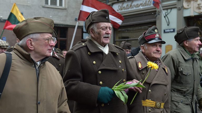 Latvia’s Waffen-SS veterans march alongside far-right lawmakers (VIDEO)