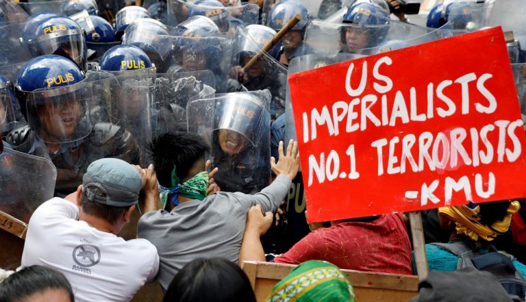 ‘No War! No Trump!’ Protesters clash with riot police ahead of Trump’s visit to Philippines