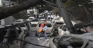 Greece wildfires: scores dead as holiday resort devastated