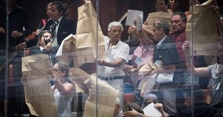 Activists wave Declaration of Independence in stormy Knesset nation-state debate