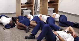 Ryanair sacks cabin crew pictured ‘sleeping on airport floor’