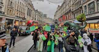 Campaigners march through London in protest against climate change