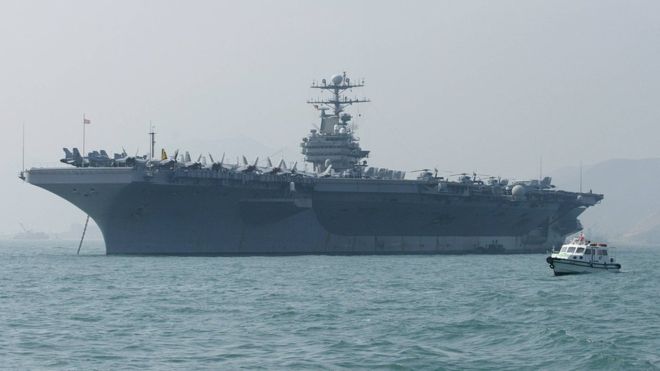 US threatens Iran with war