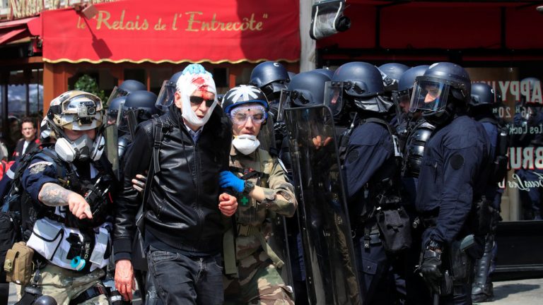 Tear gas fired during May Day demonstrations in Paris, scores detained