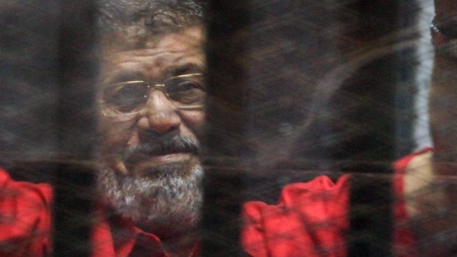 Mohamed Morsi: Six Years After Coup, Egypt’s First Democratically Elected President Dies in Court