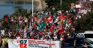 G7 opponents attend a protest in Hendaye