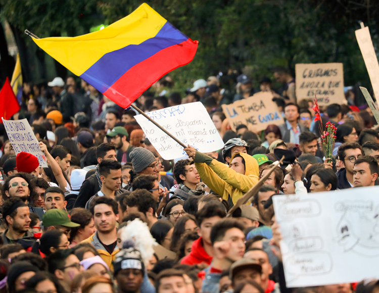Protests in Colombia, Chile resist government attacks