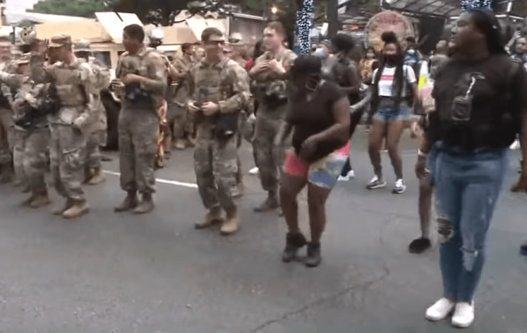 National Guard members dance with protesters in Downtown Atlanta