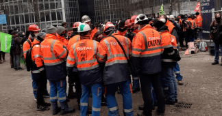 Striking French refinery workers & climate protesters clash with police outside office of oil giant Total