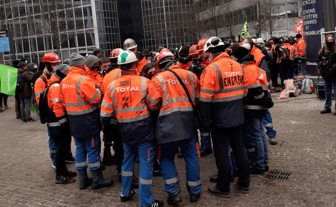 Striking French refinery workers & climate protesters clash with police outside office of oil giant Total