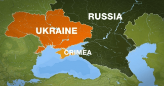 Russia orders troop pullback but keeps weapons near Ukraine