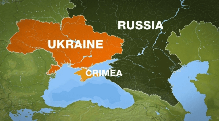 Russia orders troop pullback but keeps weapons near Ukraine