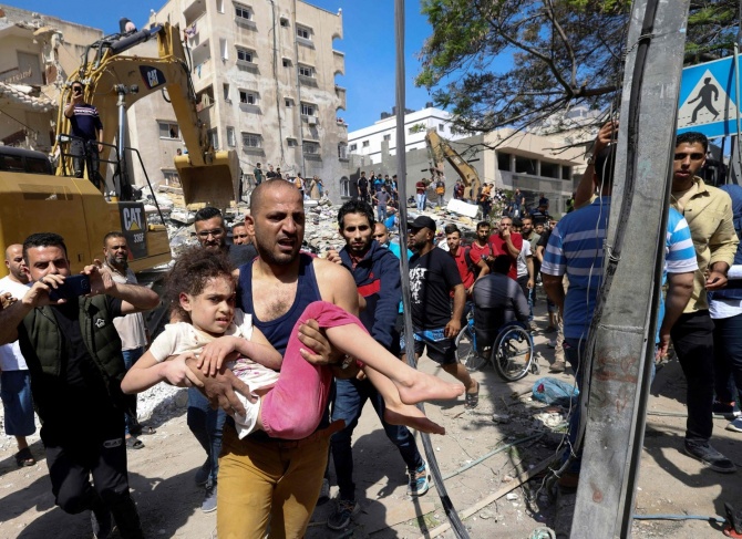 Israel warns it will bomb Gaza schools as strikes escalate