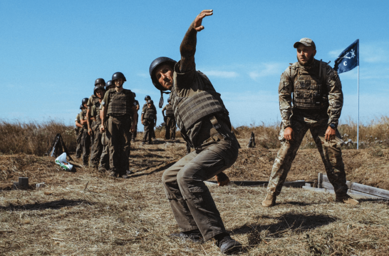 Like, Share, Recruit: How a White-Supremacist Militia Uses Facebook to Radicalize and Train New Members