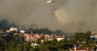 Greek wildfire rages near Athens; homes, hospital evacuated
