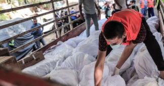 Mass burial held for Gaza’s unidentified victims of Israeli bombing