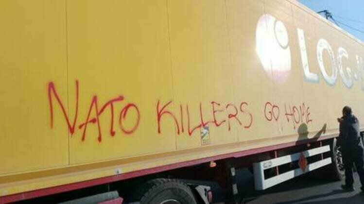Protesters in NATO country block trucks carrying weapons for Kiev
