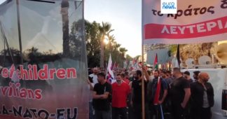 Riot police block pro-Palestine protesters from approaching Israeli cruise ship in Greece