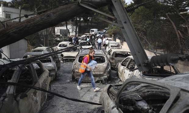Greece wildfires: scores dead as holiday resort devastated