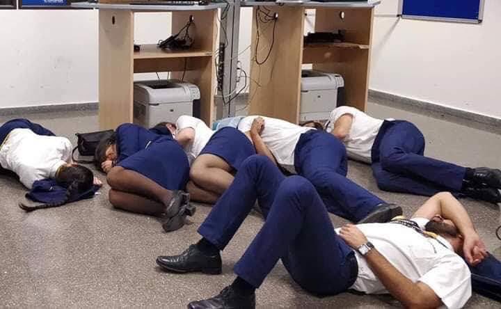 Ryanair sacks cabin crew pictured ‘sleeping on airport floor’