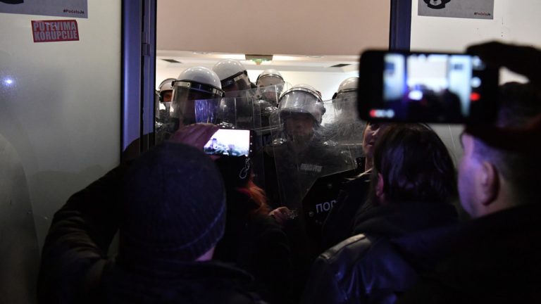 Protesters storm public broadcaster HQ in Serbia, face off with riot police