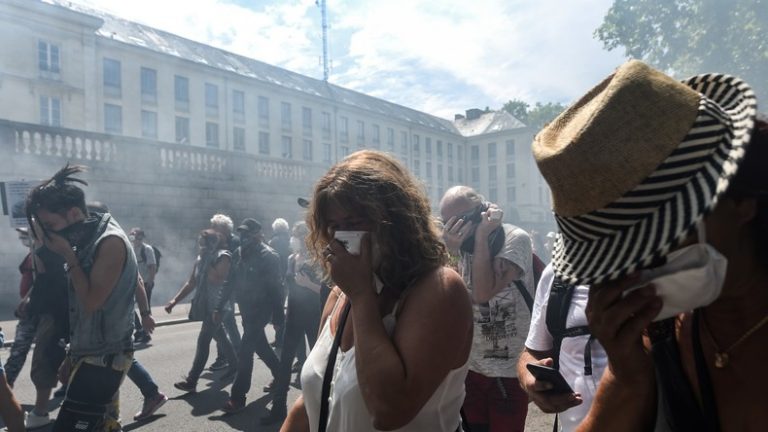 Clashes in Nantes as French police use tear gas on protesters following silent march