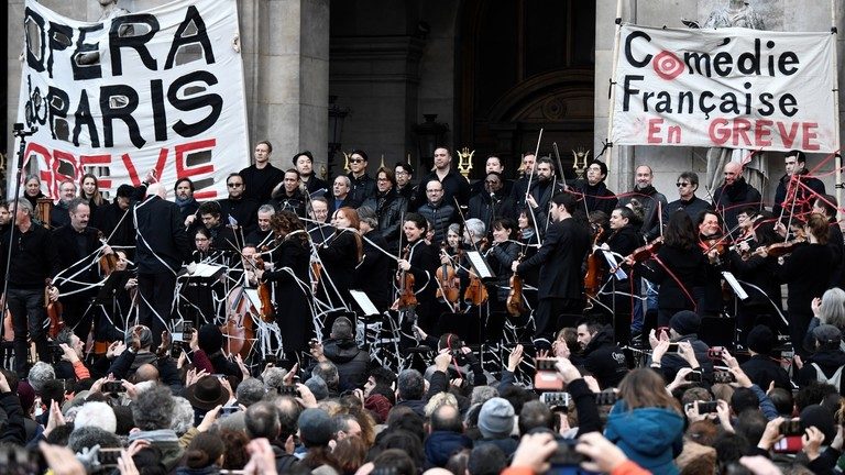 Striking Paris Opera artists perform outdoor concert against pension reforms – while Macron flees theater amid protests