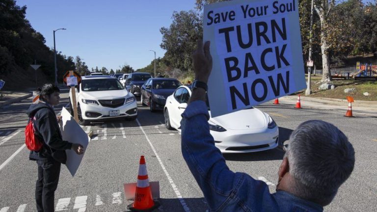 Far-right protesters temporarily shut down COVID-19 vaccinations at Dodger Stadium in Los Angeles