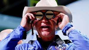 Billionaires Race to Privatize & Monopolize Space as Earth Burns & Workers Organize