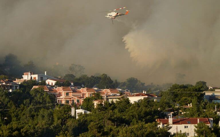Greek wildfire rages near Athens; homes, hospital evacuated