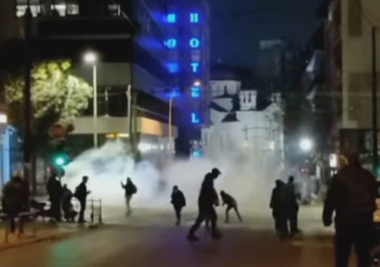 Angry protesters and police clash over deadly train crash