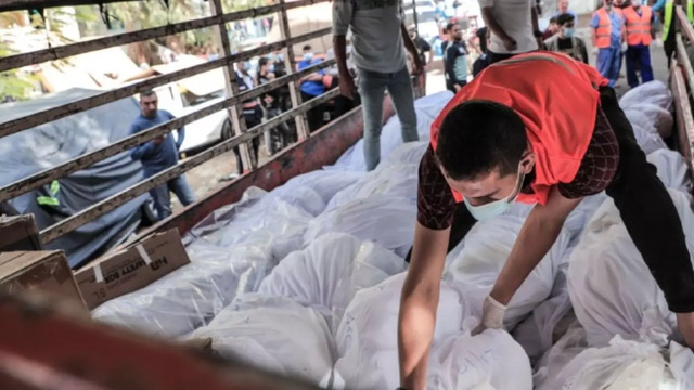 Mass burial held for Gaza’s unidentified victims of Israeli bombing