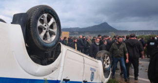 Protesting Greek farmers swarm onto apron area of international airport on Crete